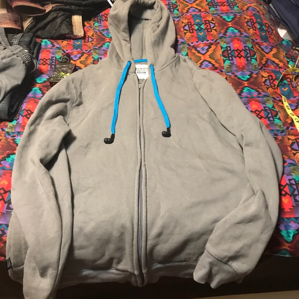 Zip up with earbuds built into hood strings