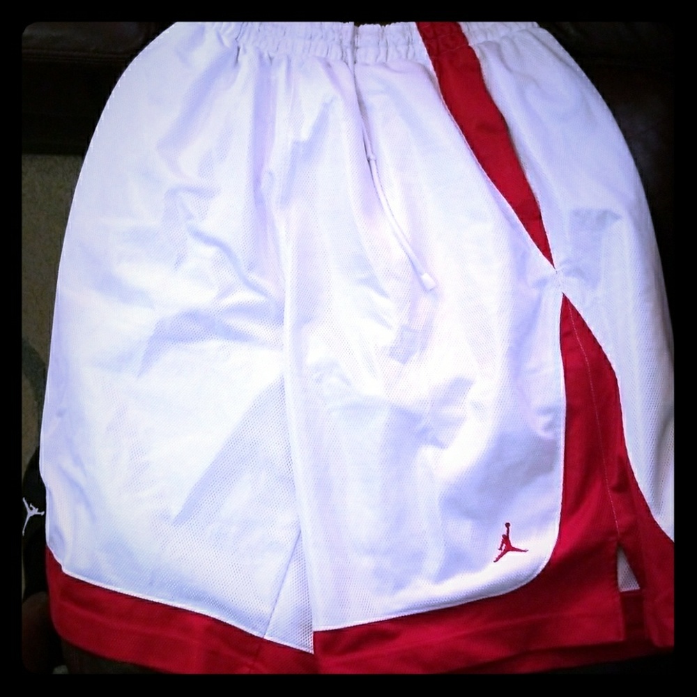 A pair of red and white Jordan short