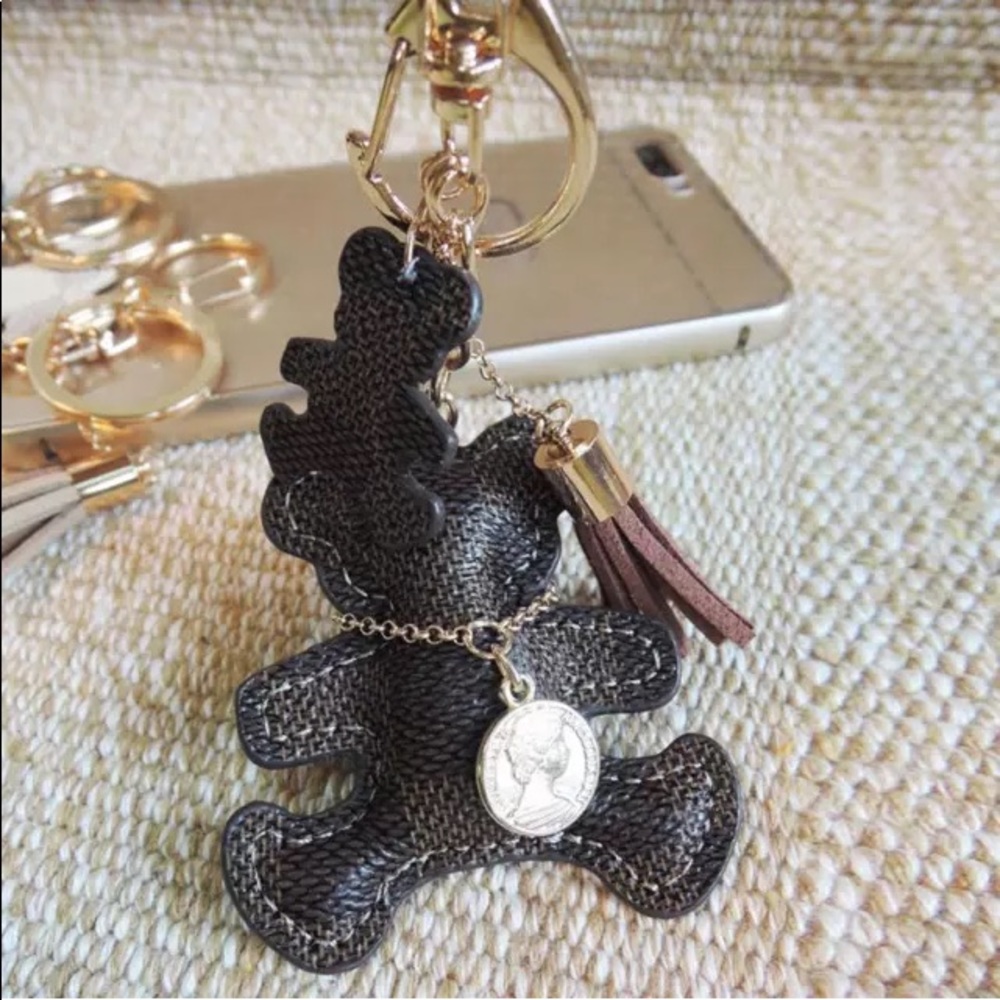 Cute leather bear keychain for your fashion bags .