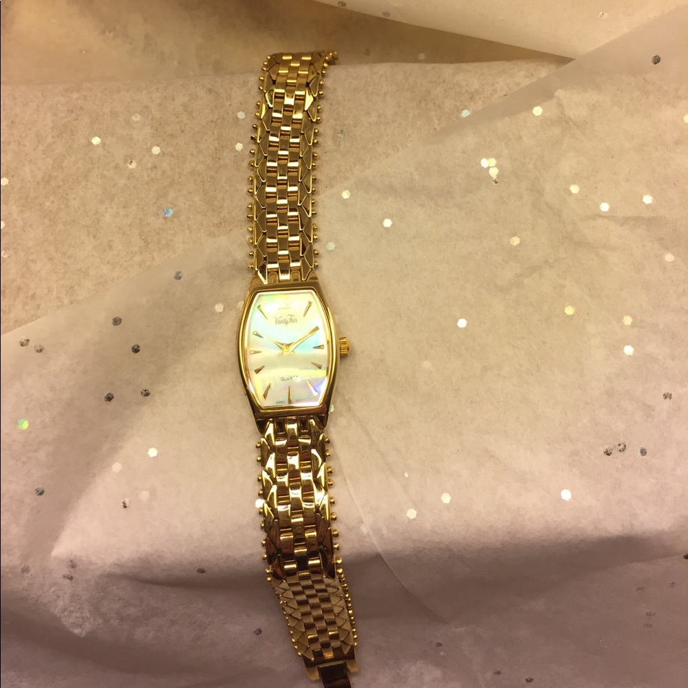 Gold toned watch.
