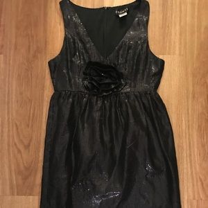 Black sequin empire waist mini dress with rosette