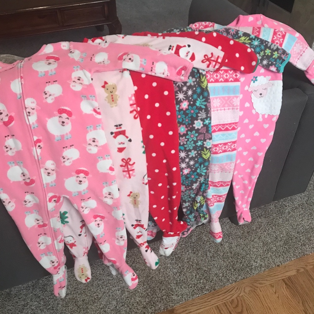 6 pairs of Carter's footie pajamas.