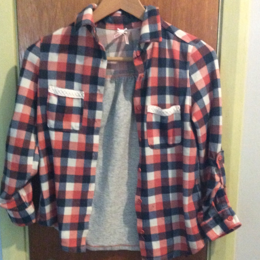 Soft and cozy checked button down top.