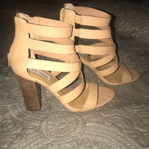 Nude strappy sandal, heel height 4 3/4 inch.