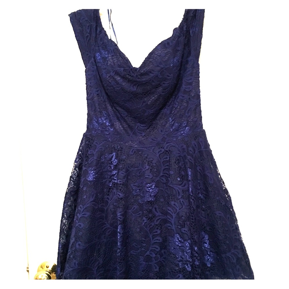 Cute, mini, blue dress with flower pattern lace.