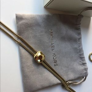 MK Urban Rush Gold toned slider pendant necklace