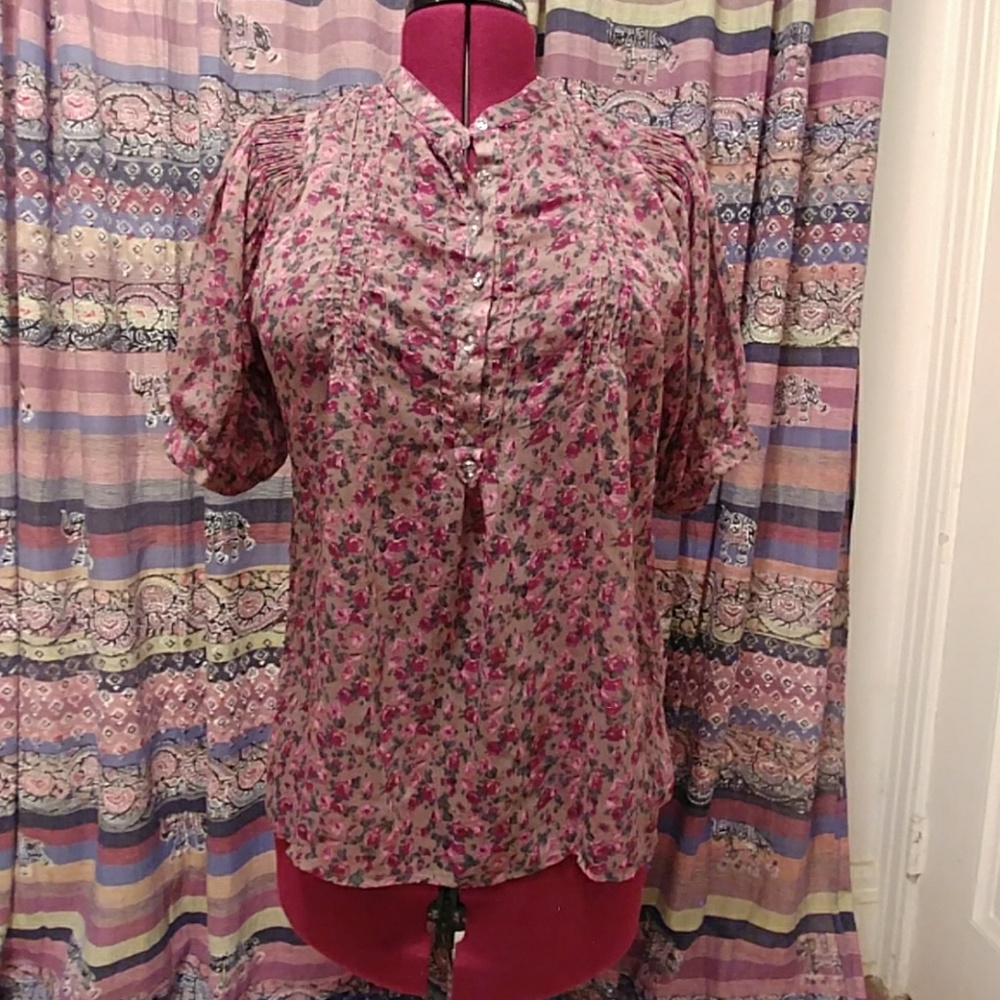 Sheer floral shirt with gatherings at shoulders.