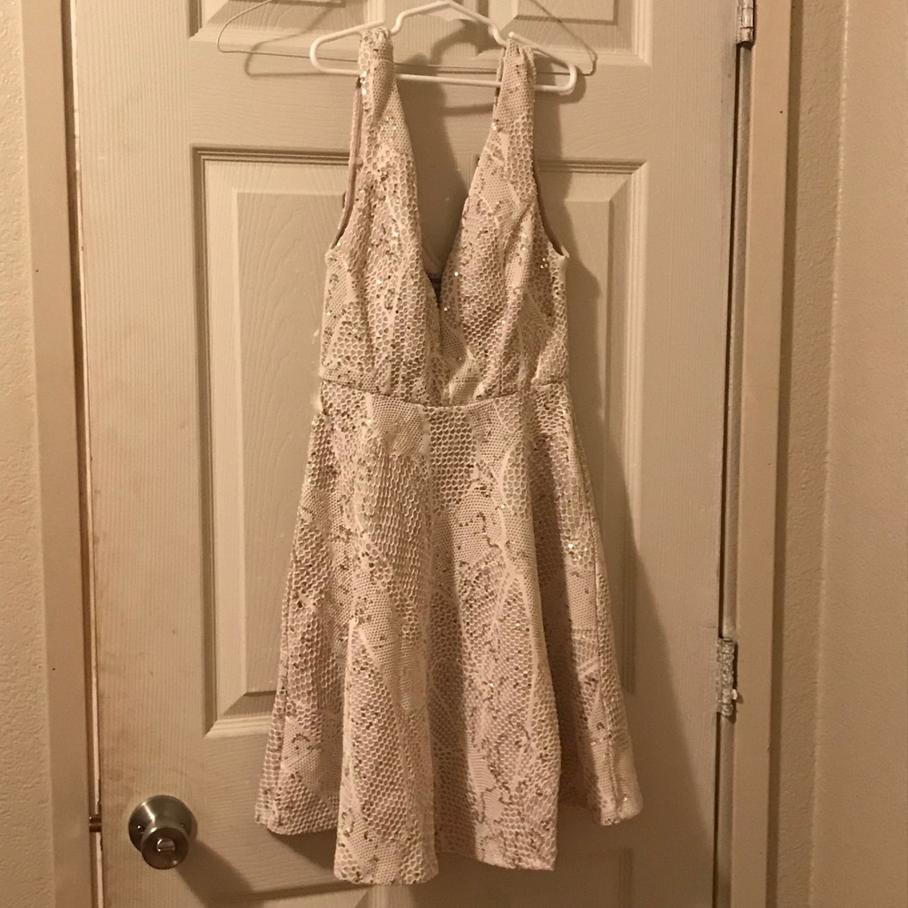Off white dress with plunging neck line.