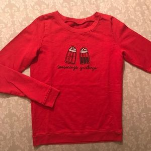 Red holiday sweater.