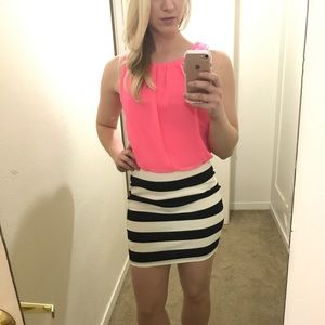 Pink and black/white striped dress.