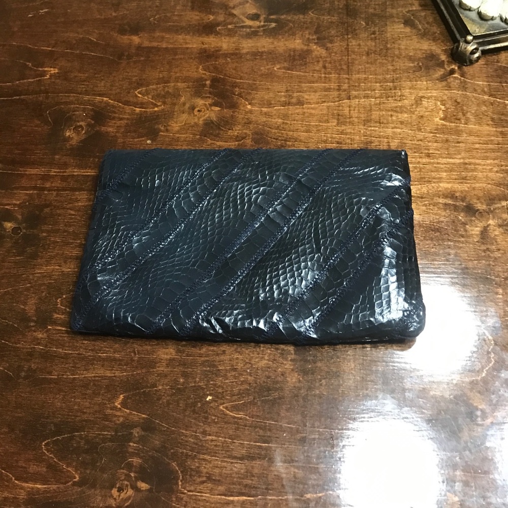 Navy snake skin and leather clutch