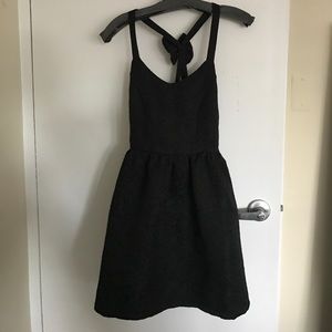 Black backless cocktail dress with bow
