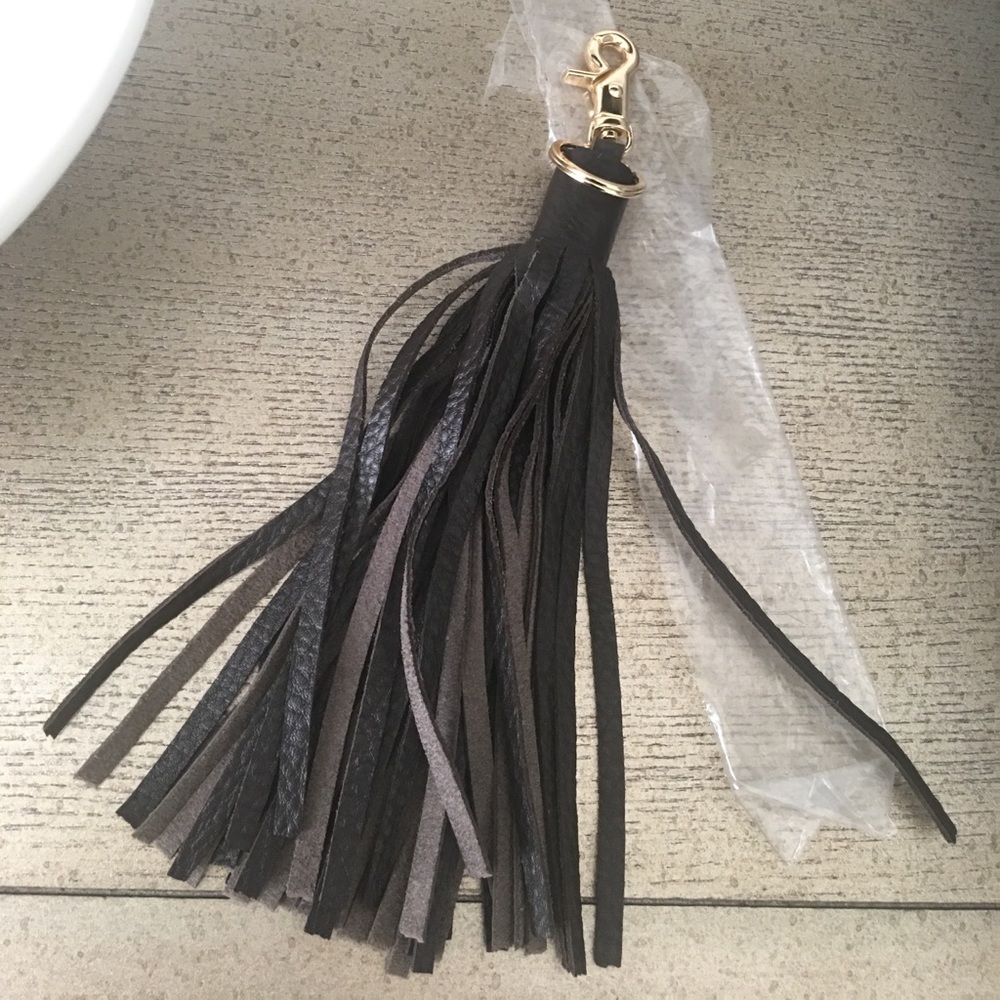 Leather tassel that clips on to any purse