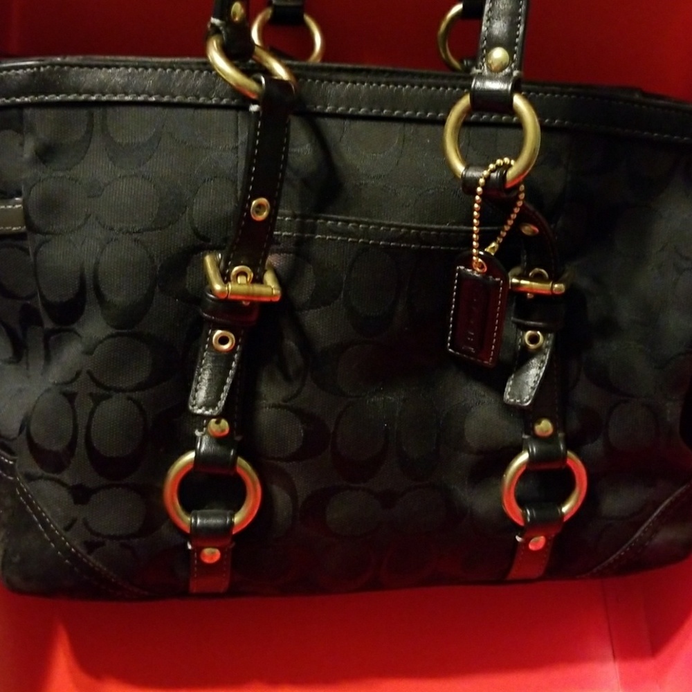 Black Coach logo fabric handbag.