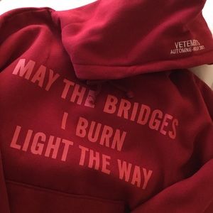 Red hoodie “may the bridges I burn light the way”