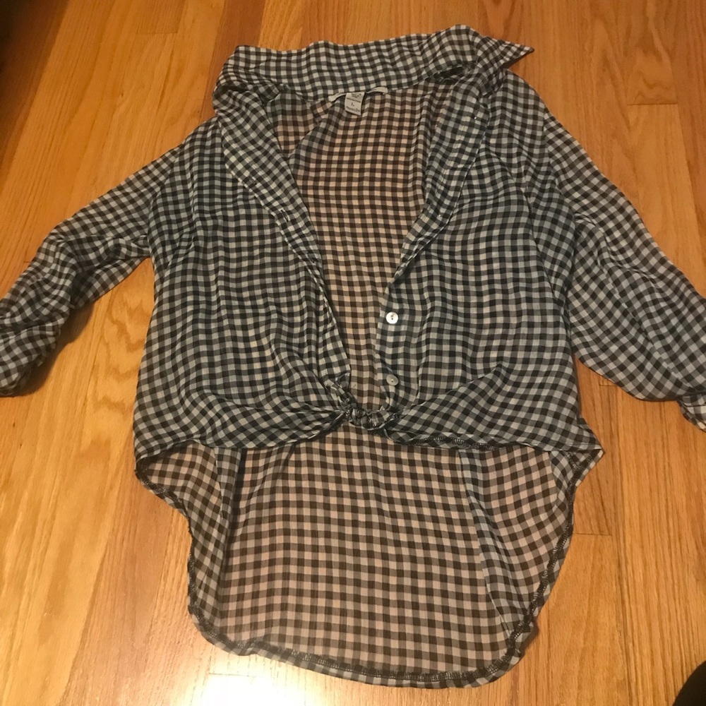 Sheer plaid shirt. Longer in back than in front.