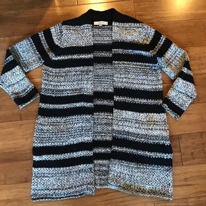 Long cozy gray and black sweater with pockets.