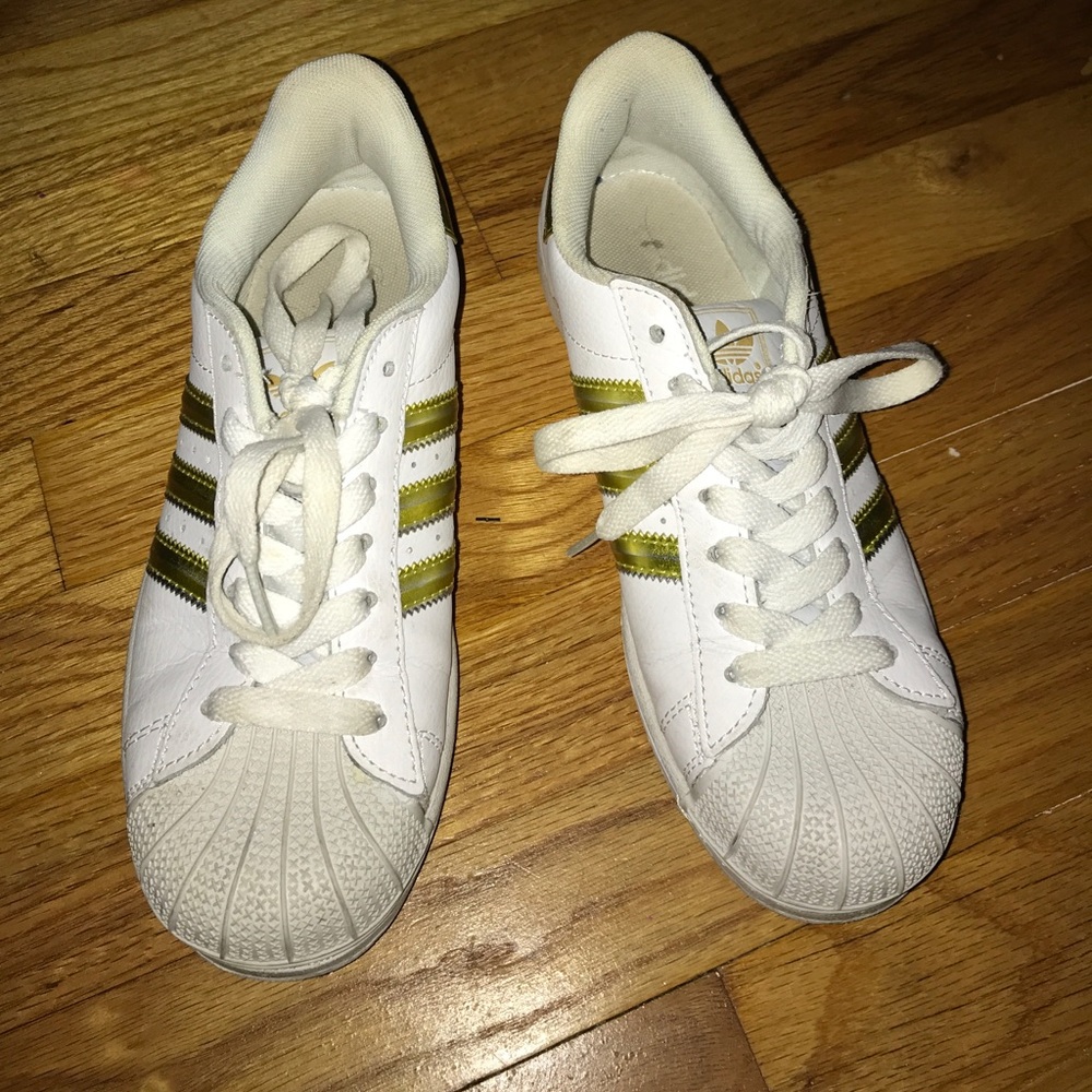 Gold stripe adidas shell toes
