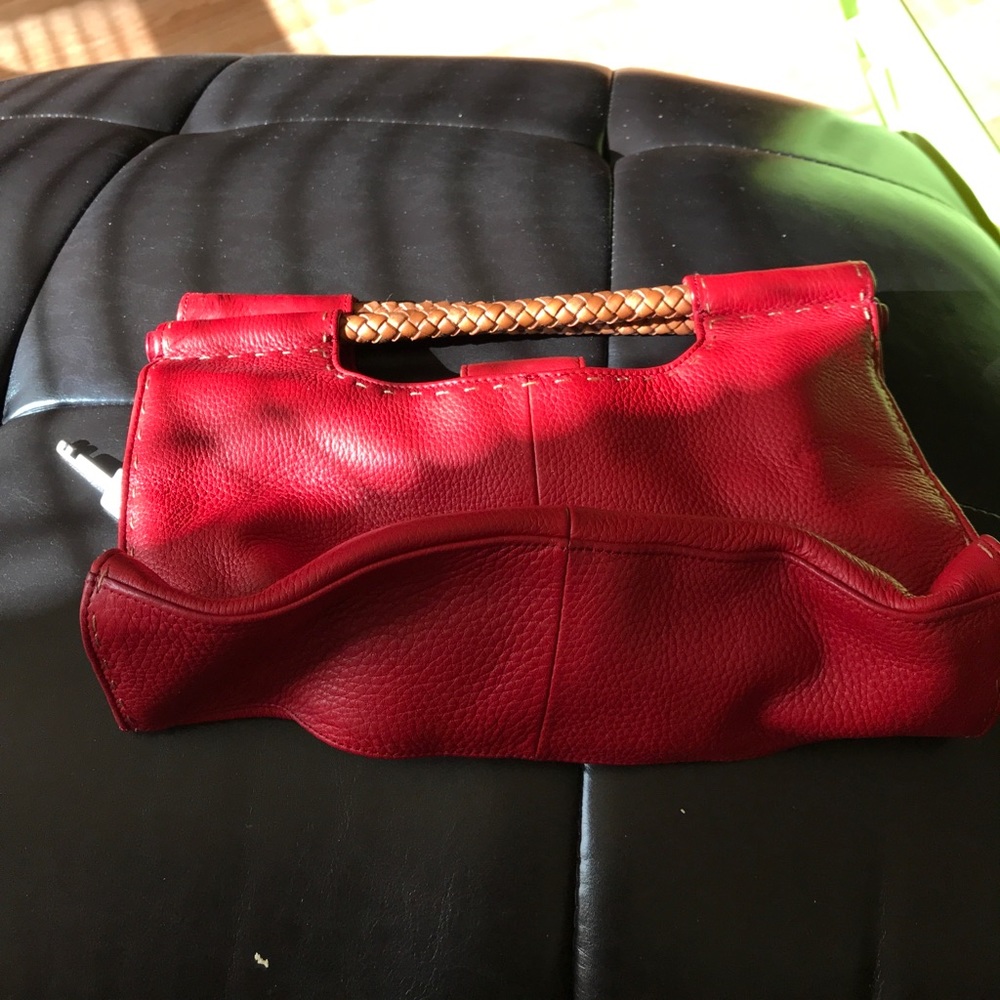 Red leather fossil clutch or hand bag