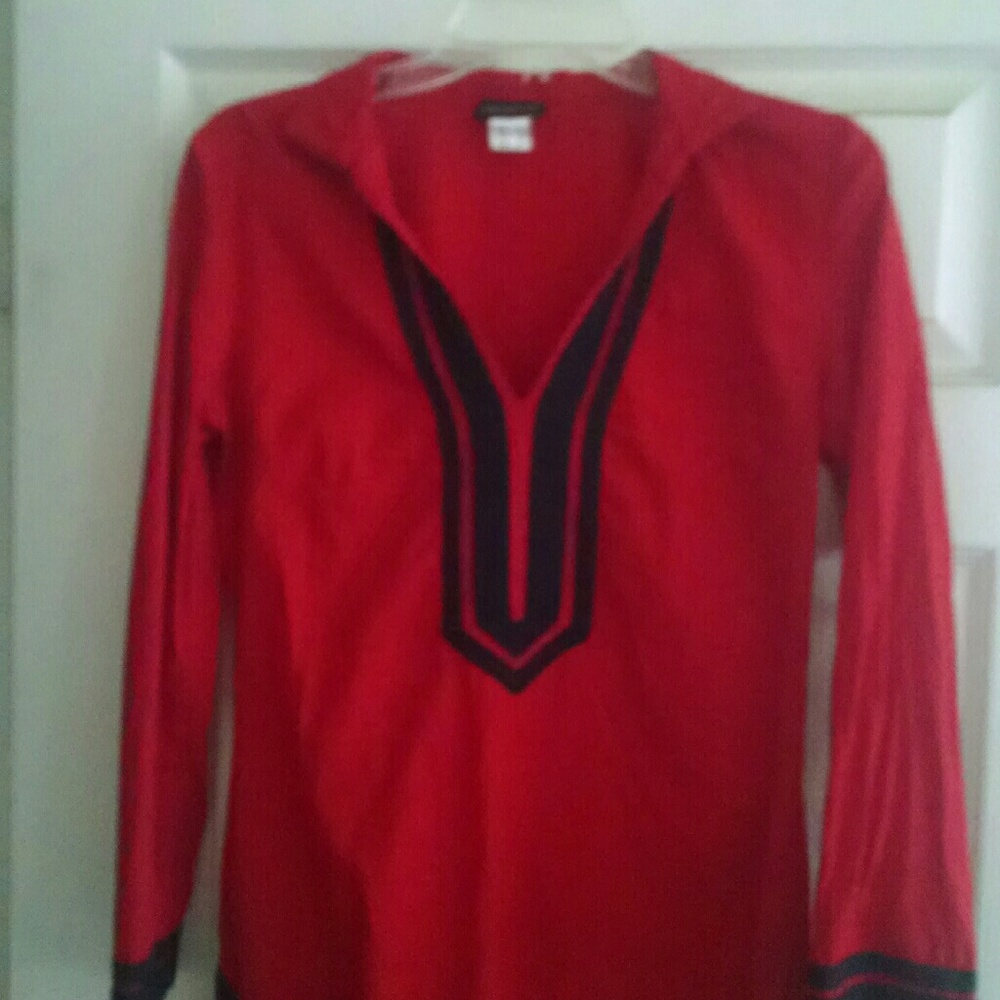 Venus Peasant red blouse with black trim.