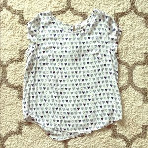 Ladies short sleeve blouse with navy hearts.