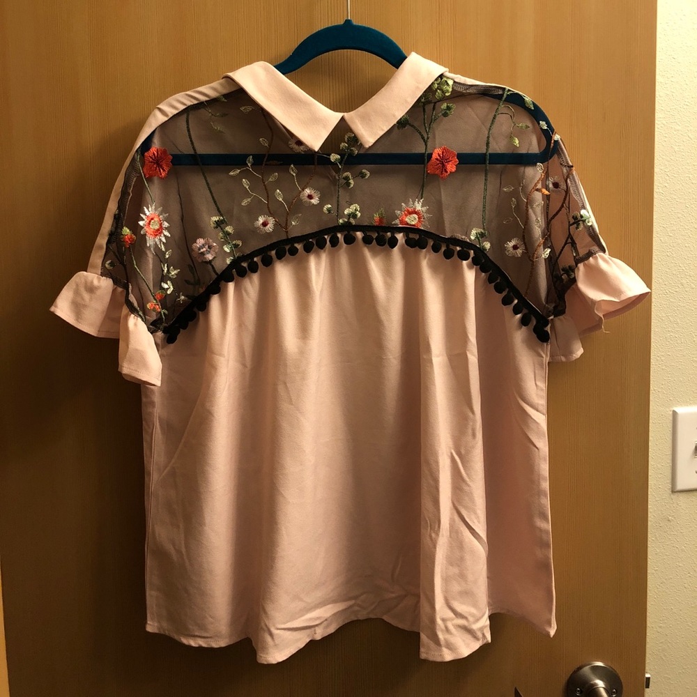 Blush and black blouse