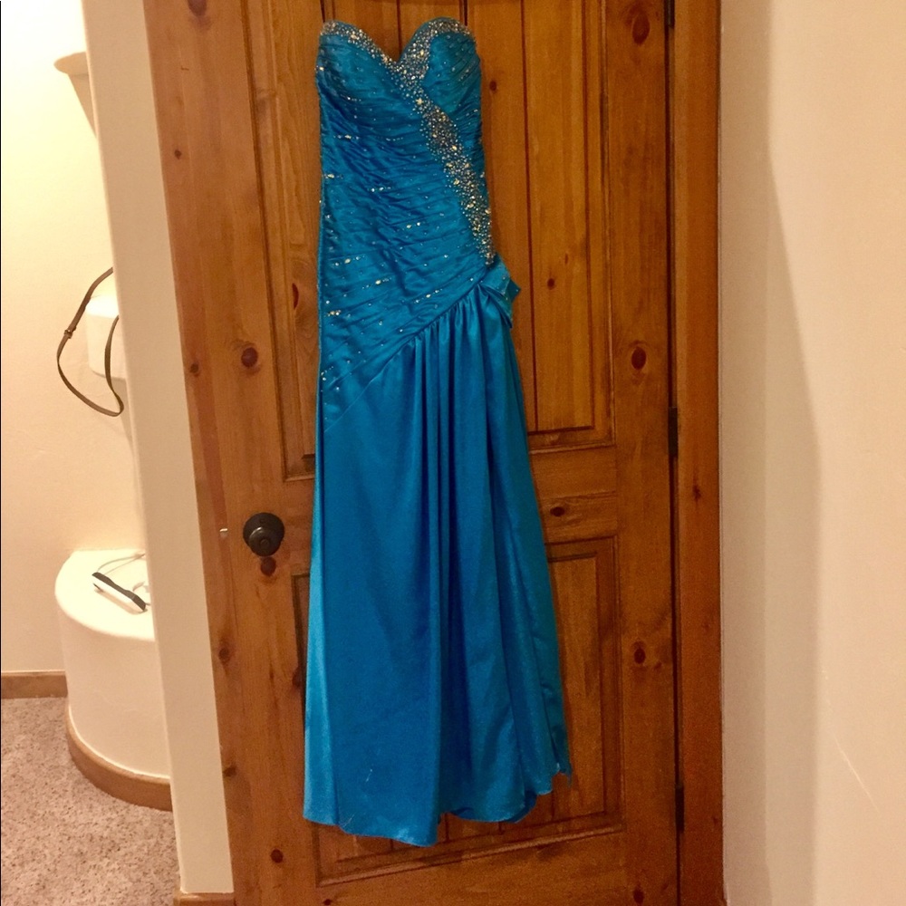 Strapless evening gown with jewel embellishment.