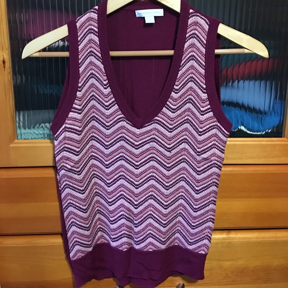 Burgundy multi colored sleeveless v-neck sweater.