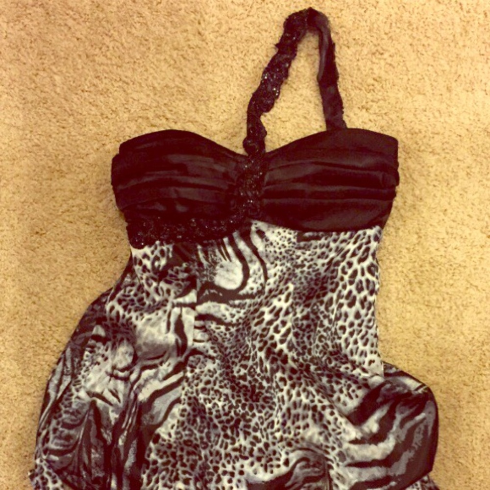 Sassy over the shoulder one of a kind dress!