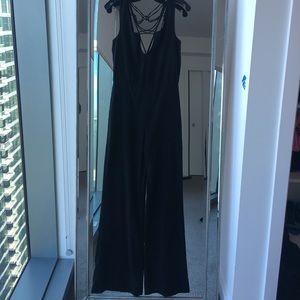 Black jumpsuit with cut out and wife legs