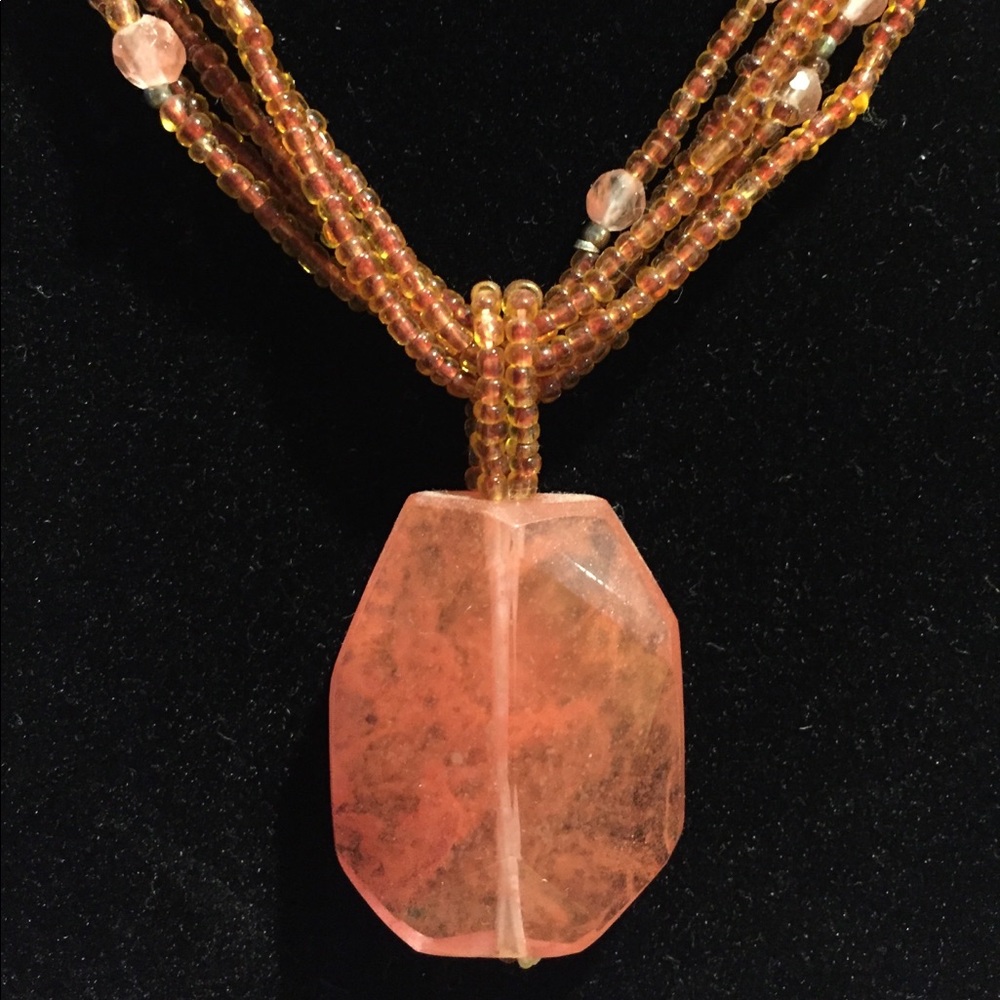 Orange beaded necklace with pendant