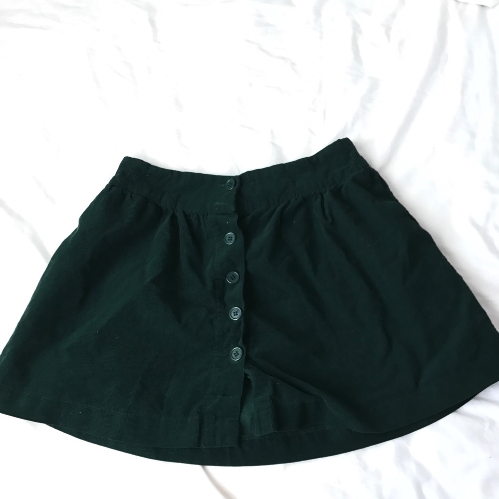 green mini skirt with buttons