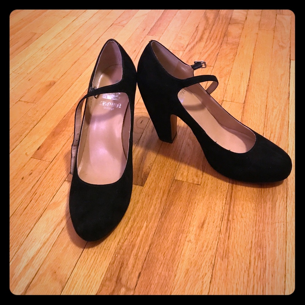 Black suede Mary Jane pumps.