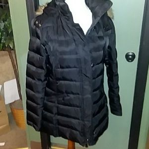 Vince Camuto puffer jacket with fur trim hood.