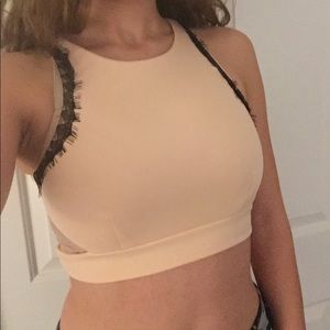 Light pink cropped top with black detailing