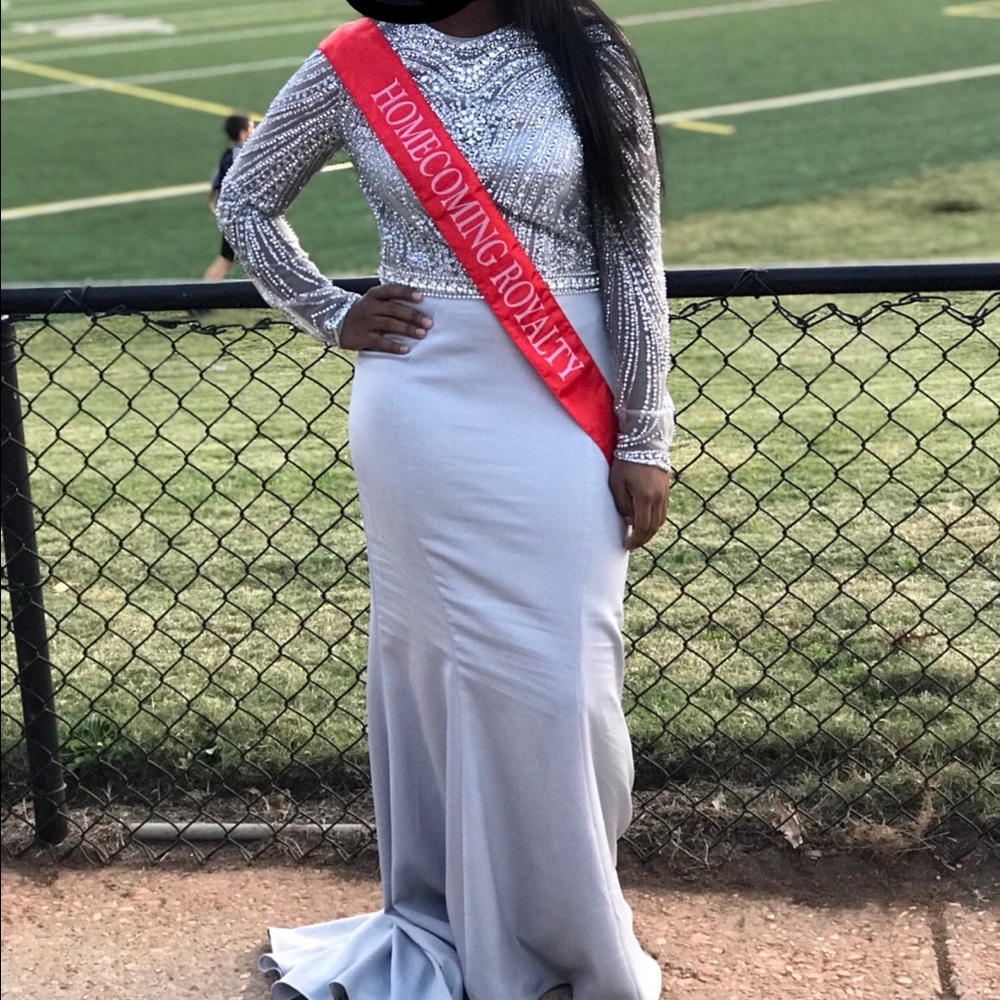Long formal silver form fitting dress. Homecoming