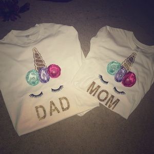 Mom (small) and dad (large) unicorn shirts.