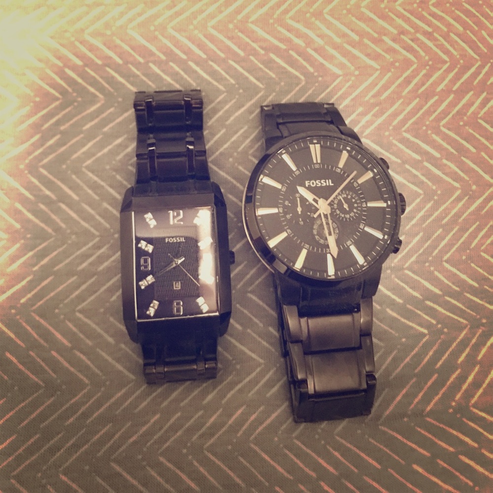 Two Black Fossil watches.