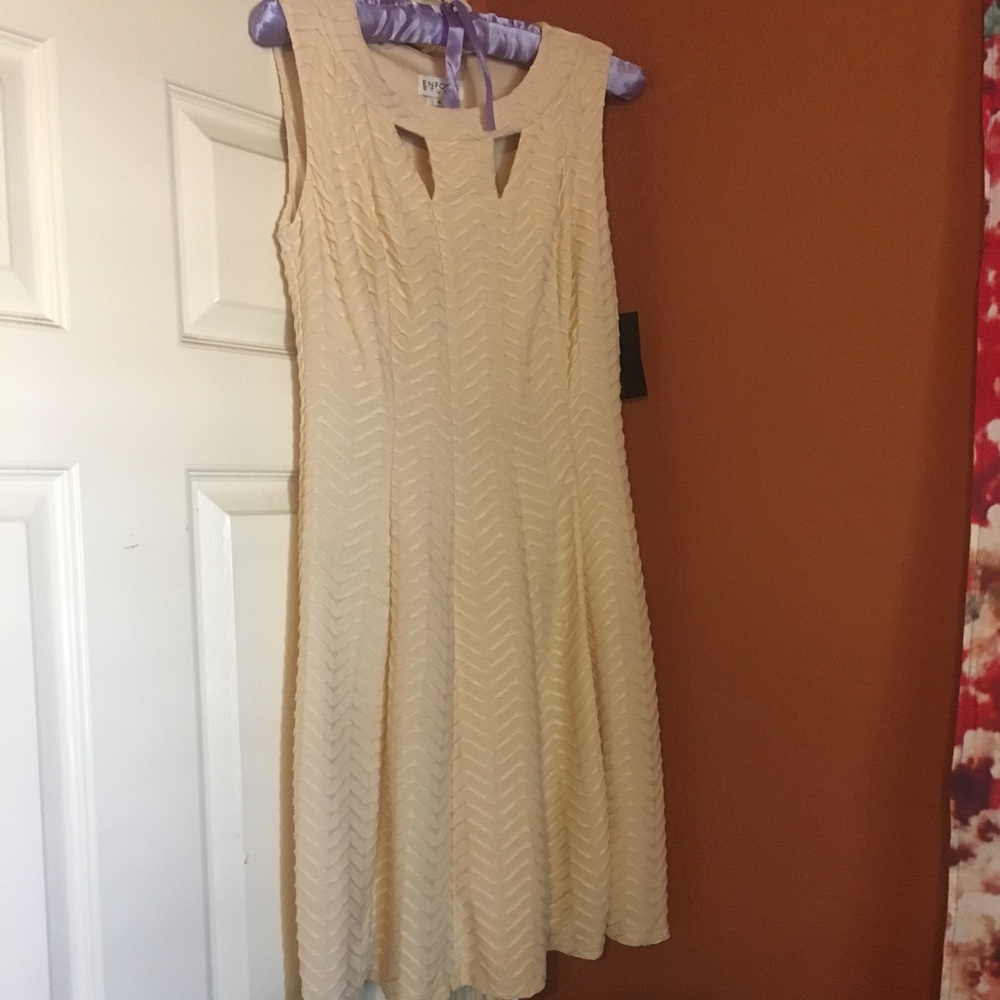 Creme colored dress never been worn