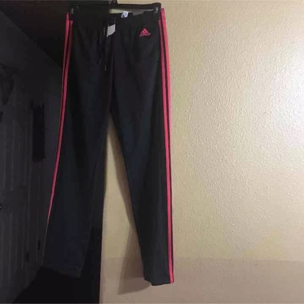 New adidas soccer pants with red stripes