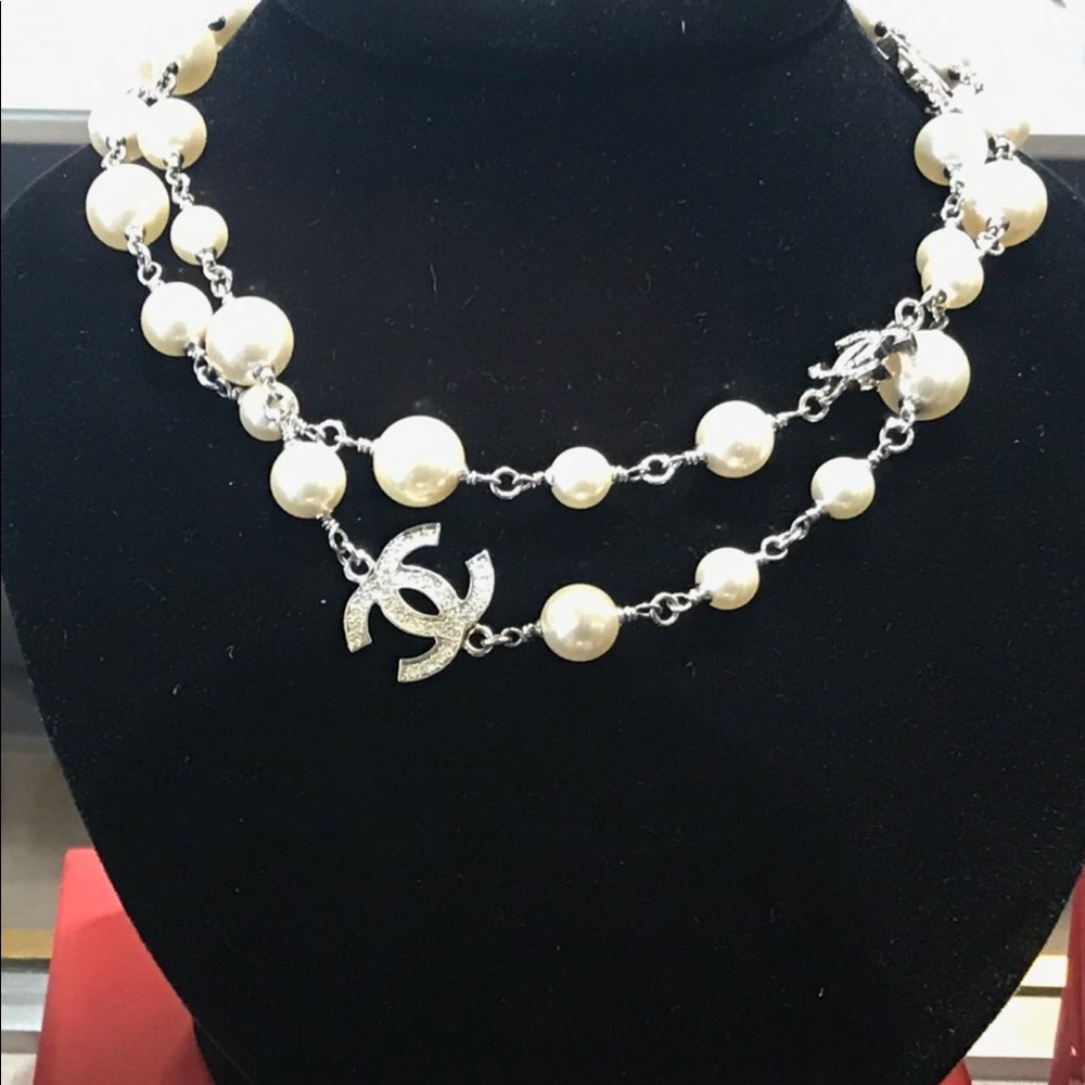 Chanel pearl and cc link necklace price firm.