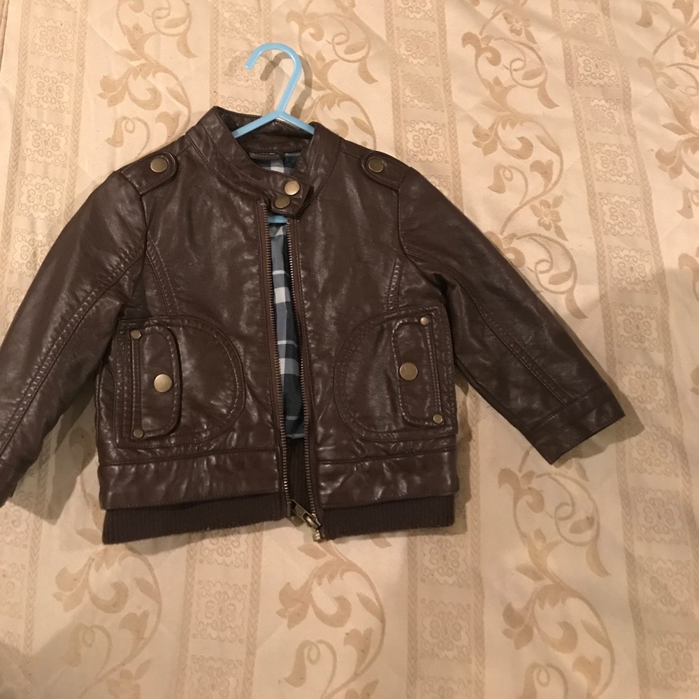 Brown bomber jacket.