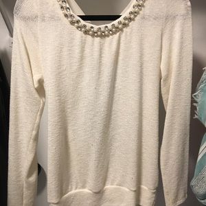 Cream sweater with open tie back