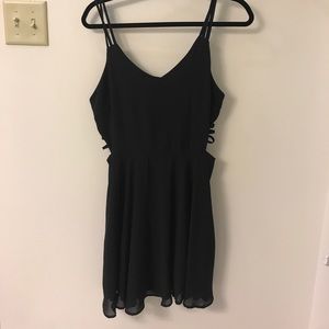 Black cocktail dress with side cut outs