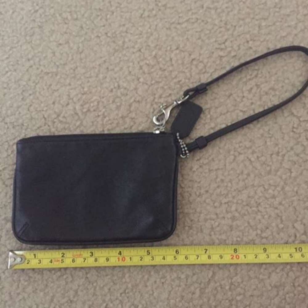 Authentic black Coach Wristlet.