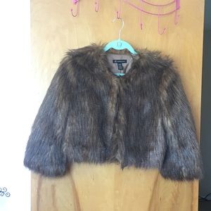 Cropped faux far jacket.