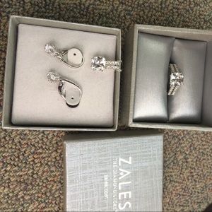 It’s a white sapphire 3 piece set, set in silver.