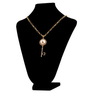 Long Gold-Tone Necklace With A Key Shaped Pendant