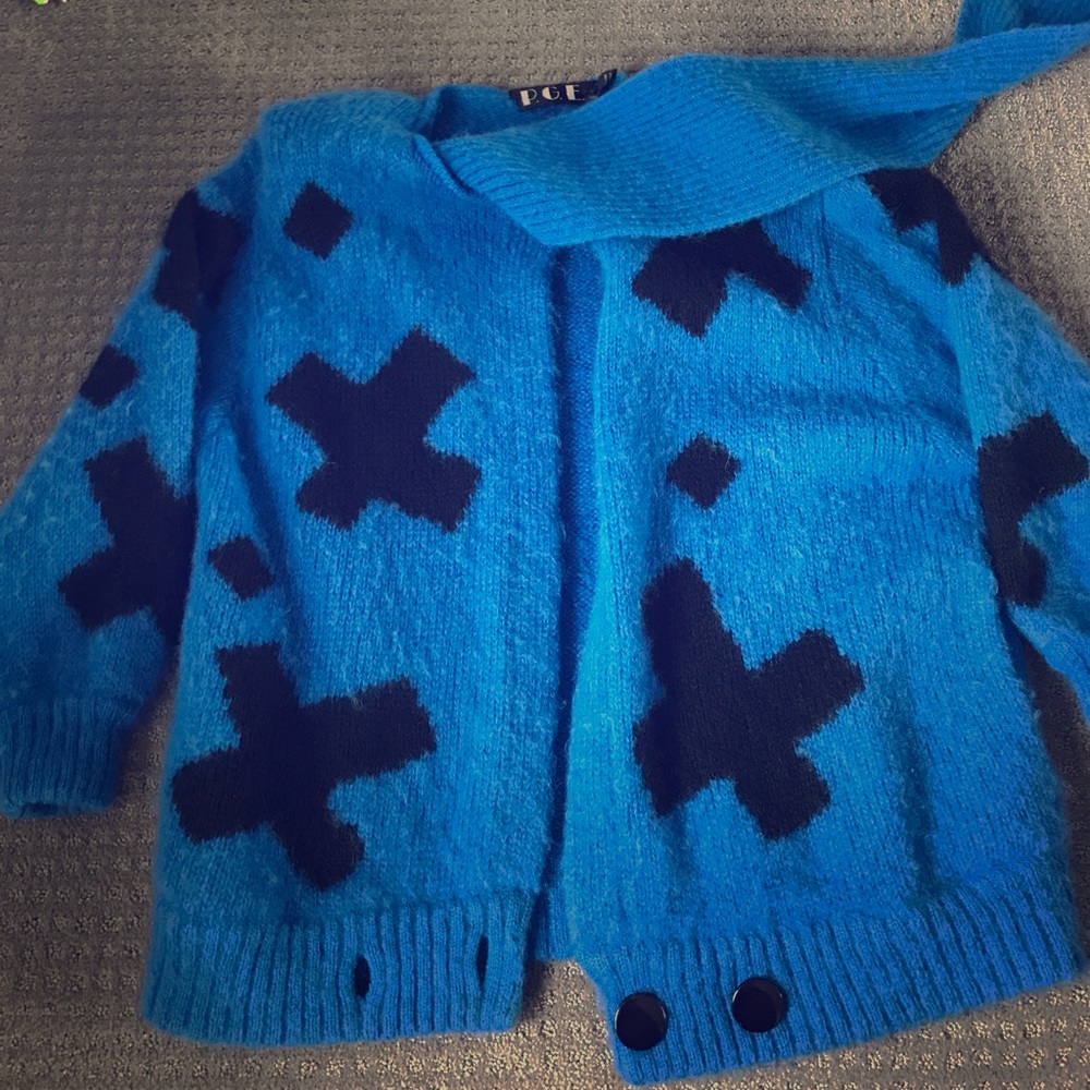 Sweater with attached scarf