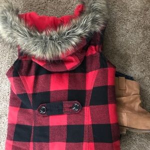 Red and black plaid vest with a fur hood